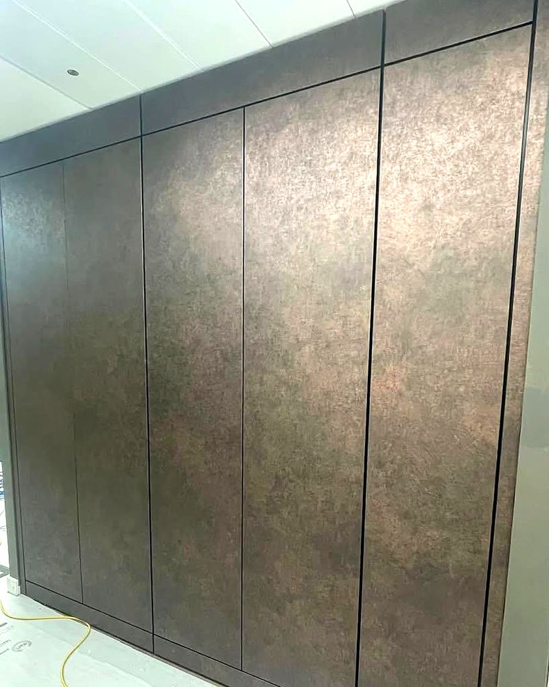 Bronze-finish wall panels, completed by ADD Construction